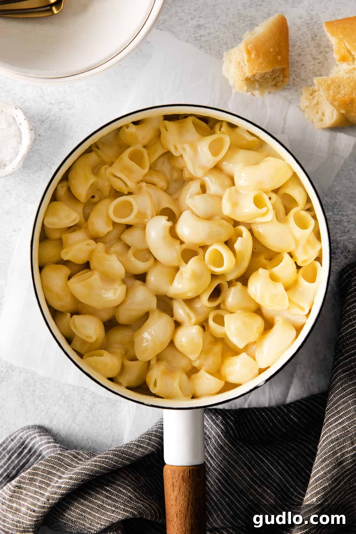 A large pot filled with freshly made homemade Panera Mac and Cheese, showcasing its creamy texture and abundant shells, ready to be served.