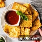 Final plate of crispy Air Fryer Pasta Chips with a side of dip