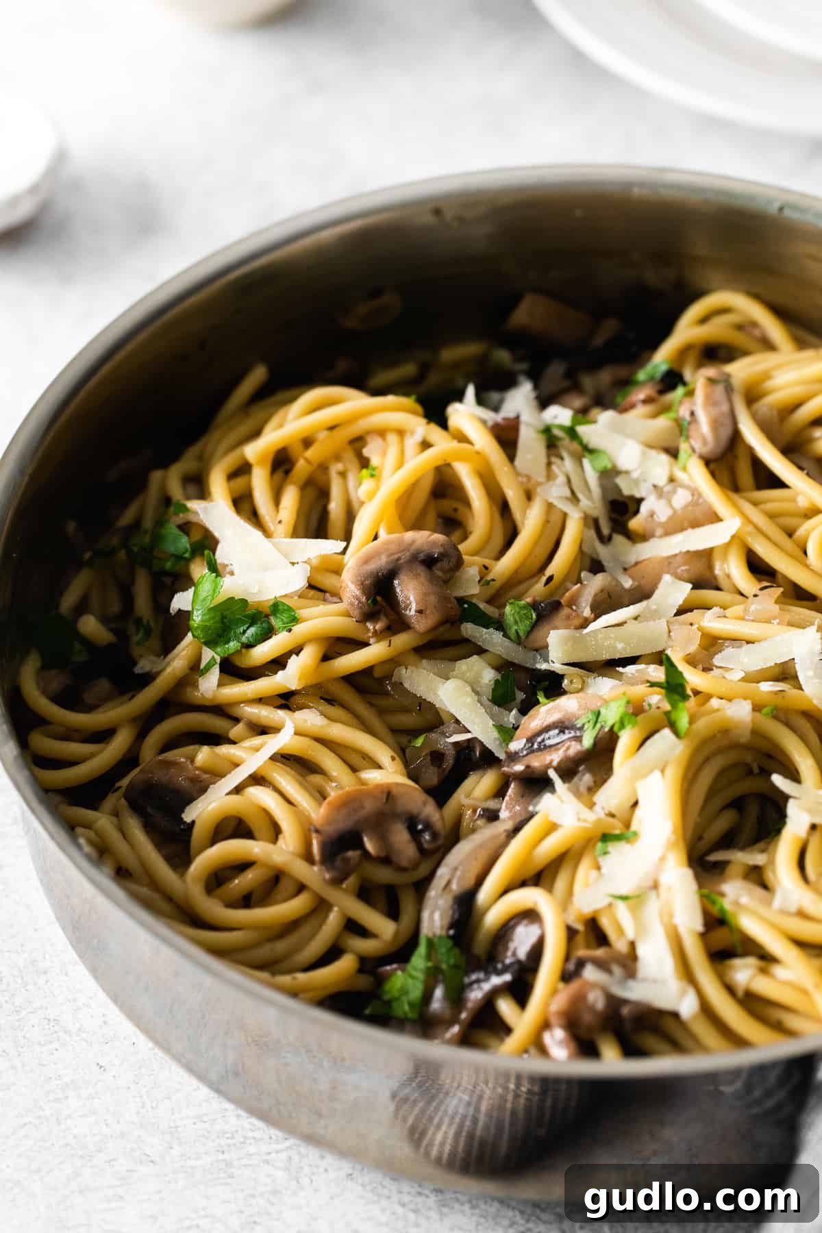 pasta in skillet, garnished and ready to serve
