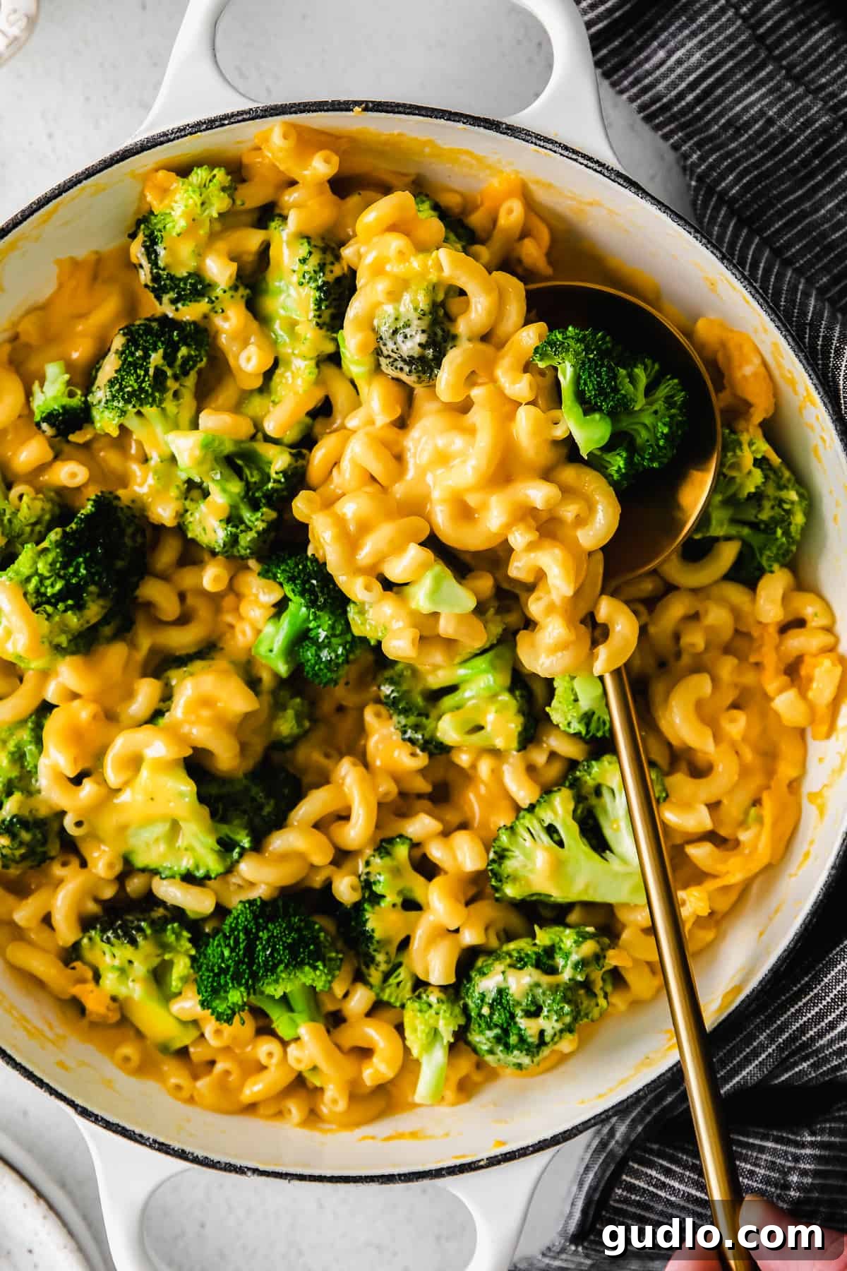 Broccoli Mac and Cheese in Pot A large pot filled with freshly made, creamy broccoli mac and cheese, steam rising gently, ready to be served.