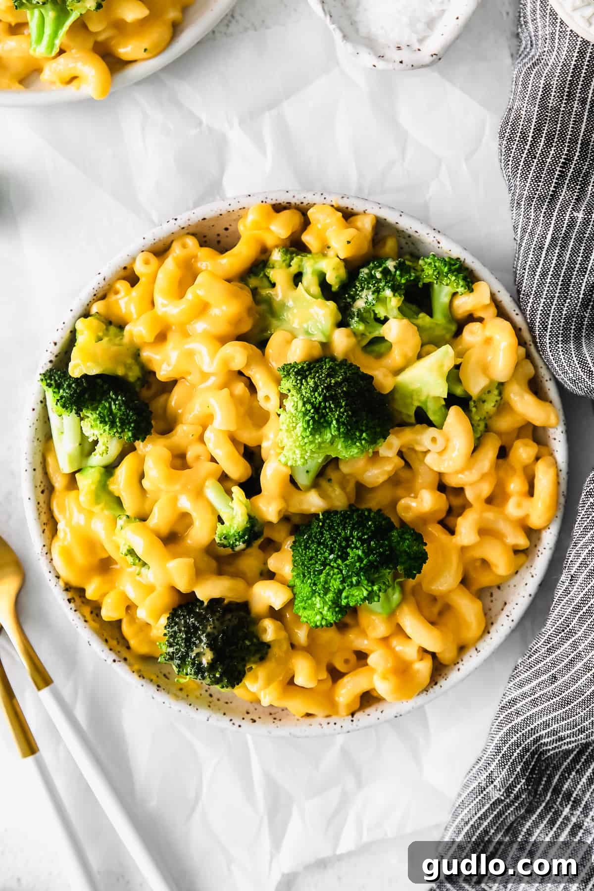 Garden Mac and Cheese 3 A close-up of a serving of broccoli mac and cheese, perfectly portioned and ready to eat.