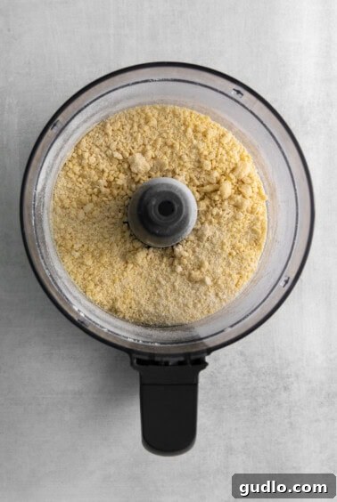 a food processor filled with flour.