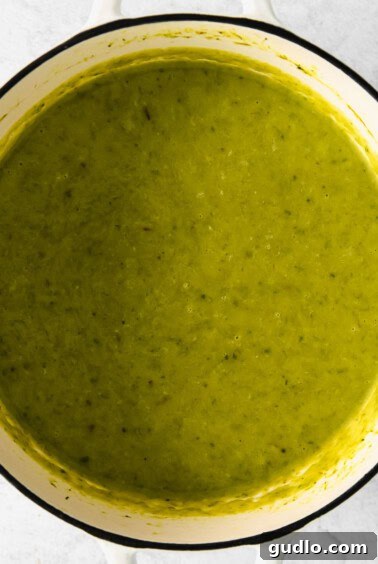 Smooth, pureed asparagus soup in a pot after blending.