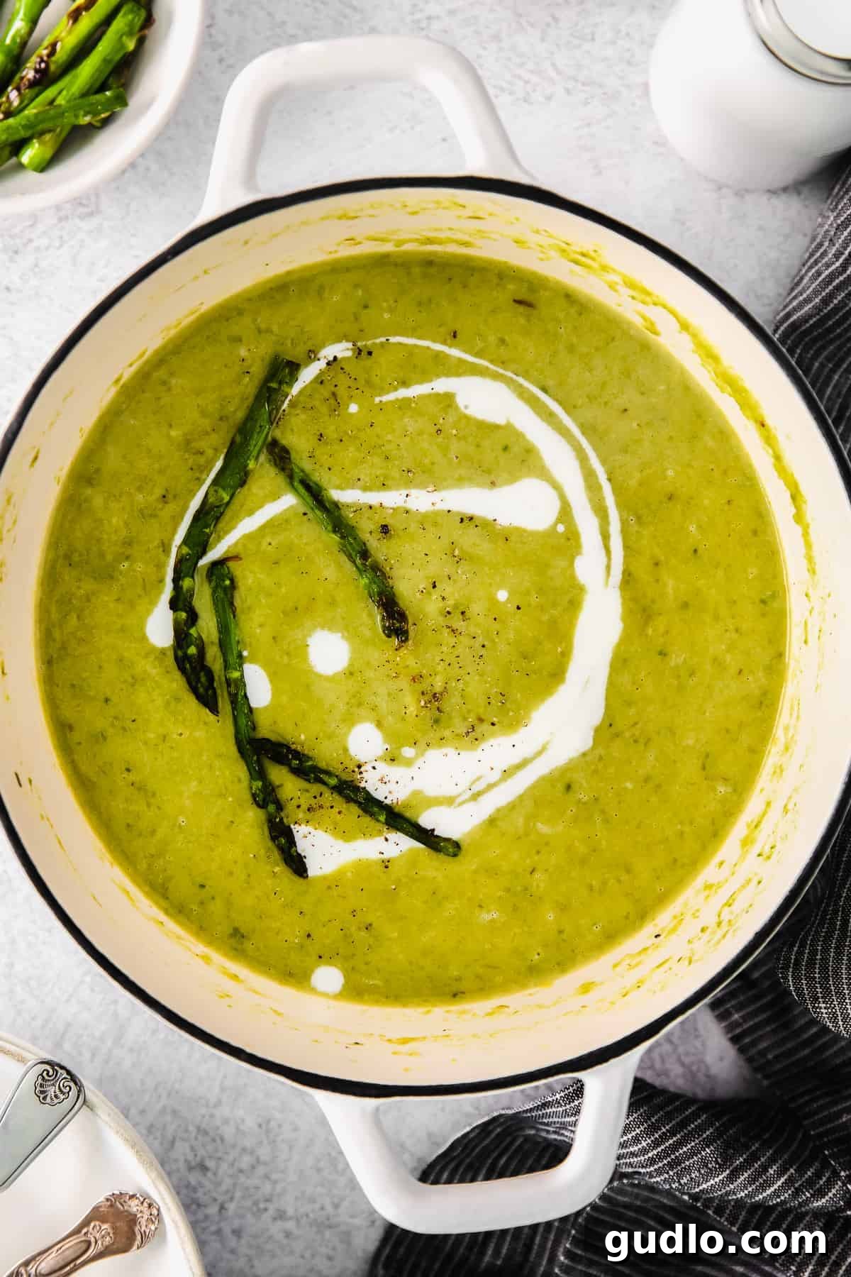 A large pot of creamy asparagus soup, ready to be served.
