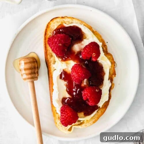 A completed mascarpone toast, beautifully plated and ready to be served, showcasing its delicious toppings.