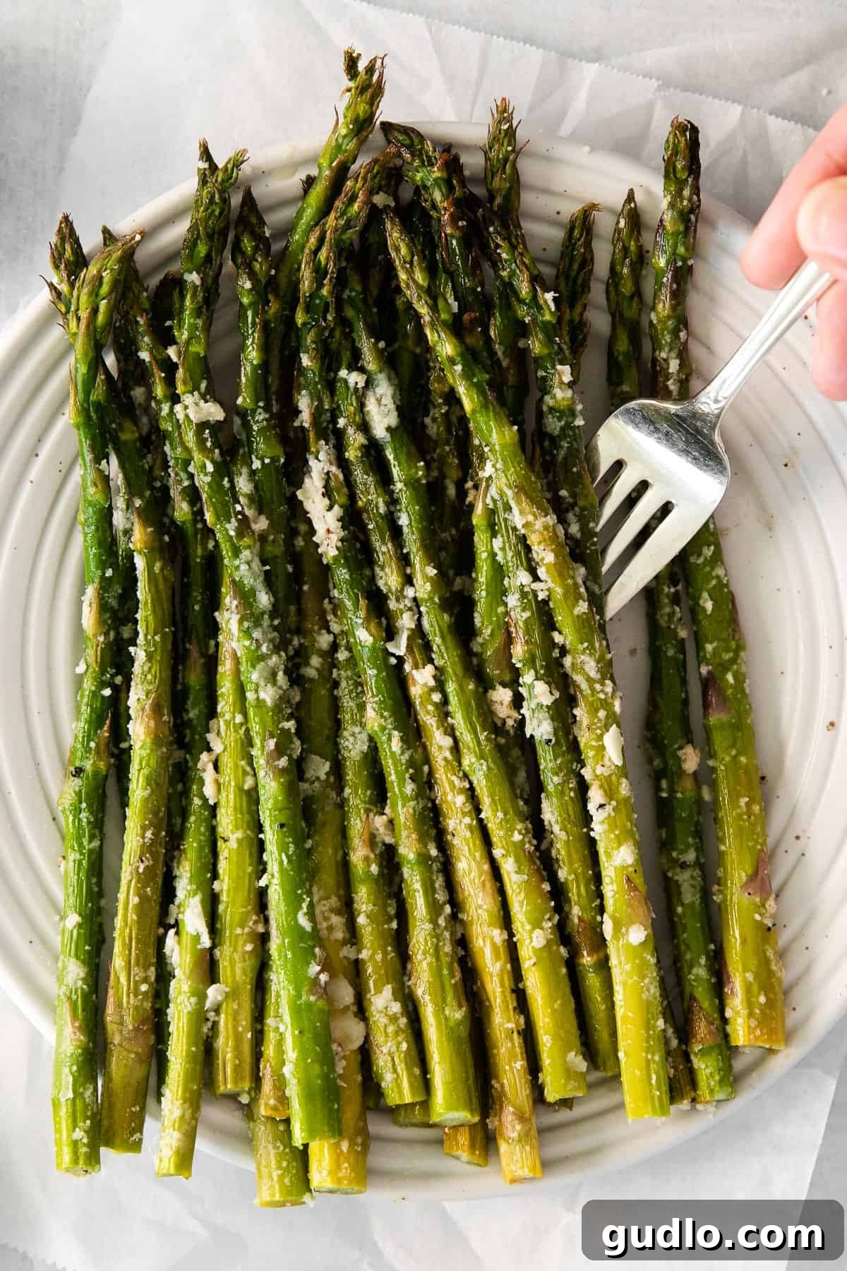 Perfectly Roasted Parmesan Asparagus: A Culinary Delight A close-up of tender-crisp roasted parmesan asparagus, highlighting the golden cheese and vibrant green stalks.