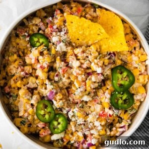 Quick and Crispy Air Fryer Quesadillas 2 A vibrant Mexican corn salad with a creamy dressing, served in a bowl.