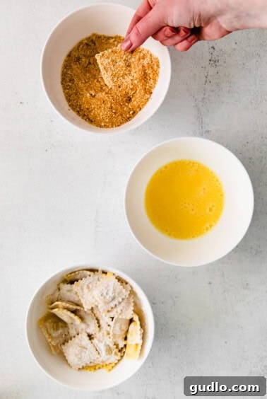 Dip the floured ravioli into the bread crumb mixture before cooking.