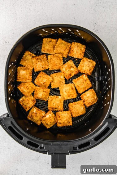 Air fryer ravioli in the air fryer.