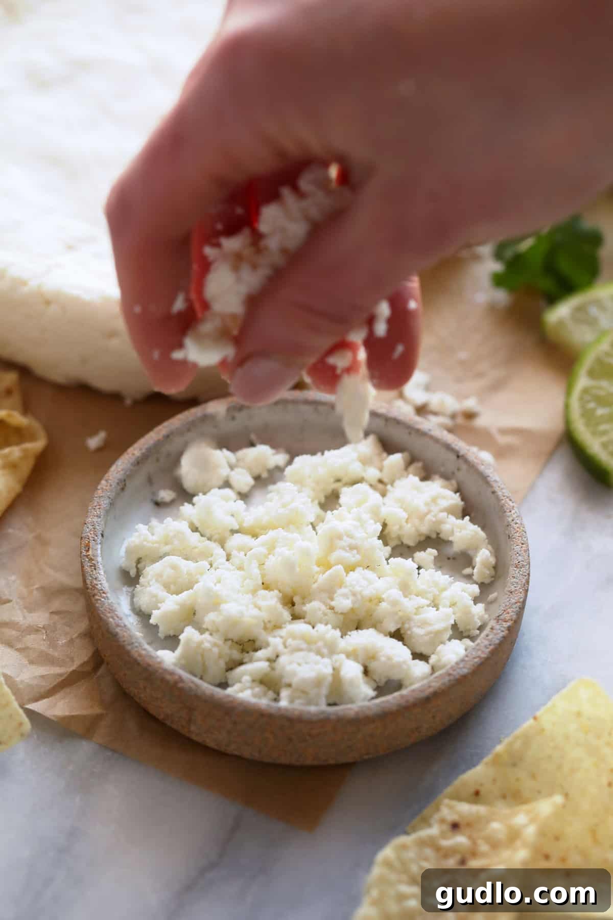 Crumbled Cotija cheese, ready to be sprinkled on dishes.
