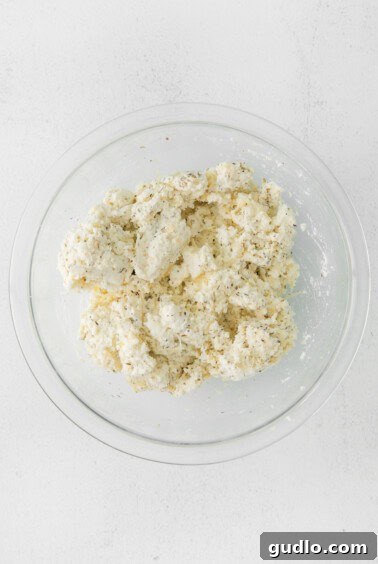Ricotta cheese mixture in a glass bowl.