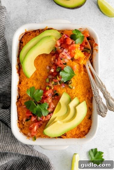 Cheesy Taco Bake 15 Baked sweet potato casserole with avocado and cilantro garnish.