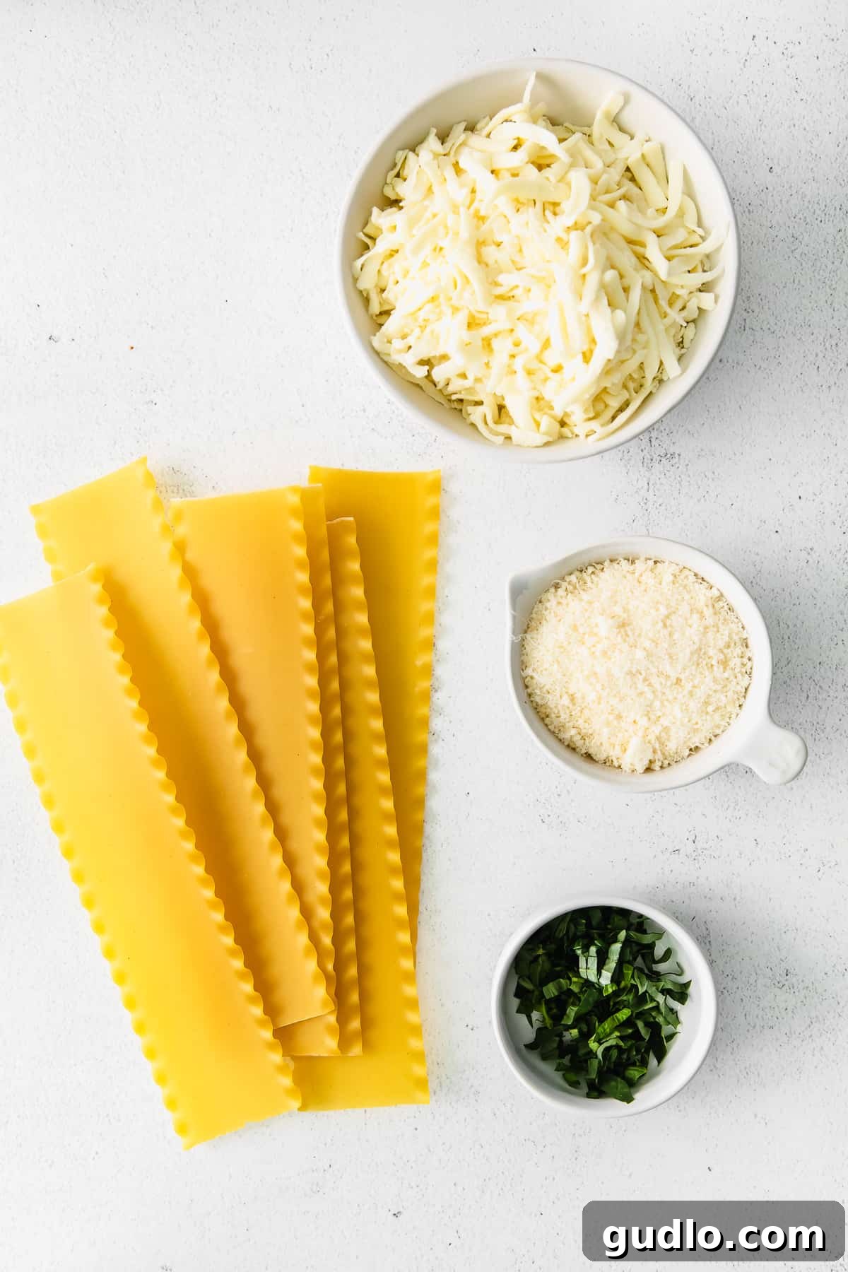 Lasagna Noodles for Layering Stacks of uncooked lasagna noodles, ready to be prepared for layering in the bechamel lasagna recipe.