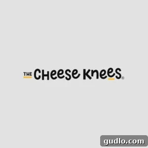 A logo with the text 'The Cheese Knees' in a playful font, featuring small yellow accents. The text is centered on a light grey background.