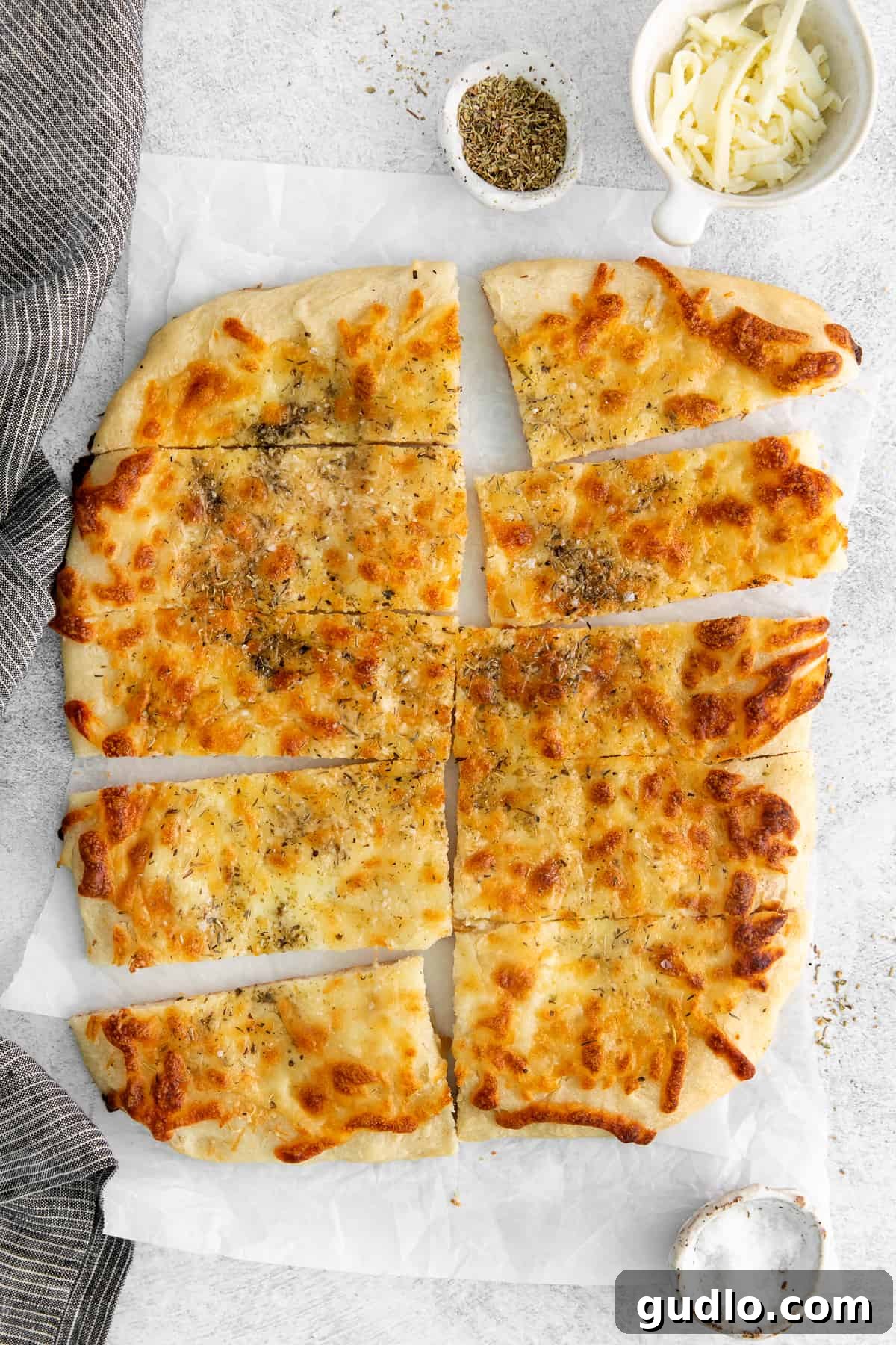 Perfectly Sliced Cheese Bread Sliced homemade cheese bread arranged on a board, ready to be enjoyed.