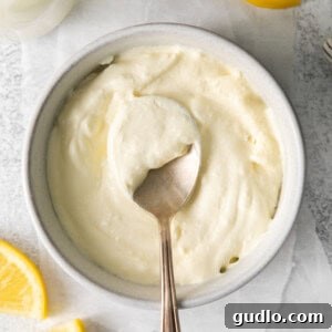 A bowl of creamy homemade mascarpone cheese, ready for use in recipes.