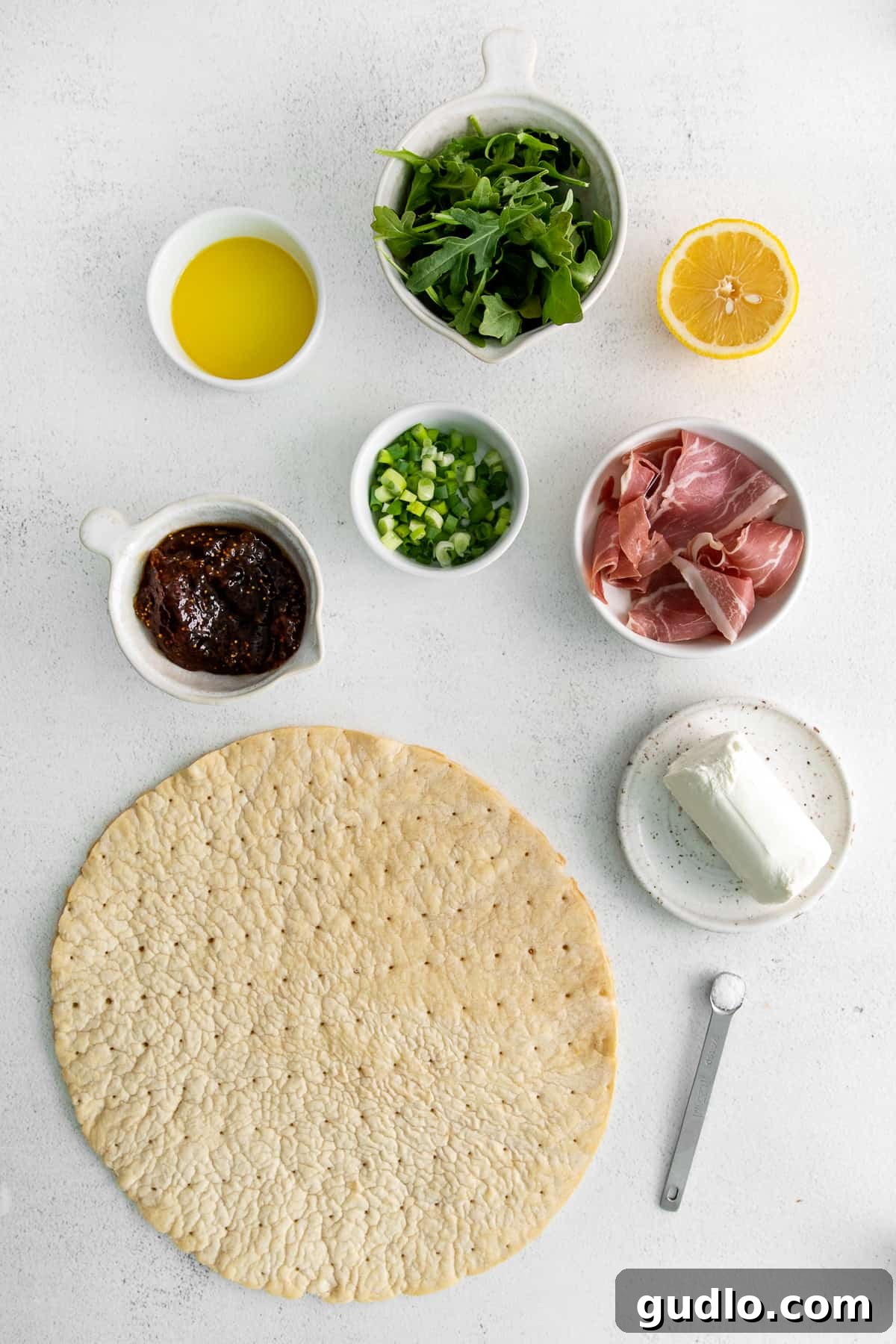 Fresh Ingredients for Fig and Goat Cheese Flatbread A selection of fresh, high-quality ingredients laid out for making fig and goat cheese flatbread.