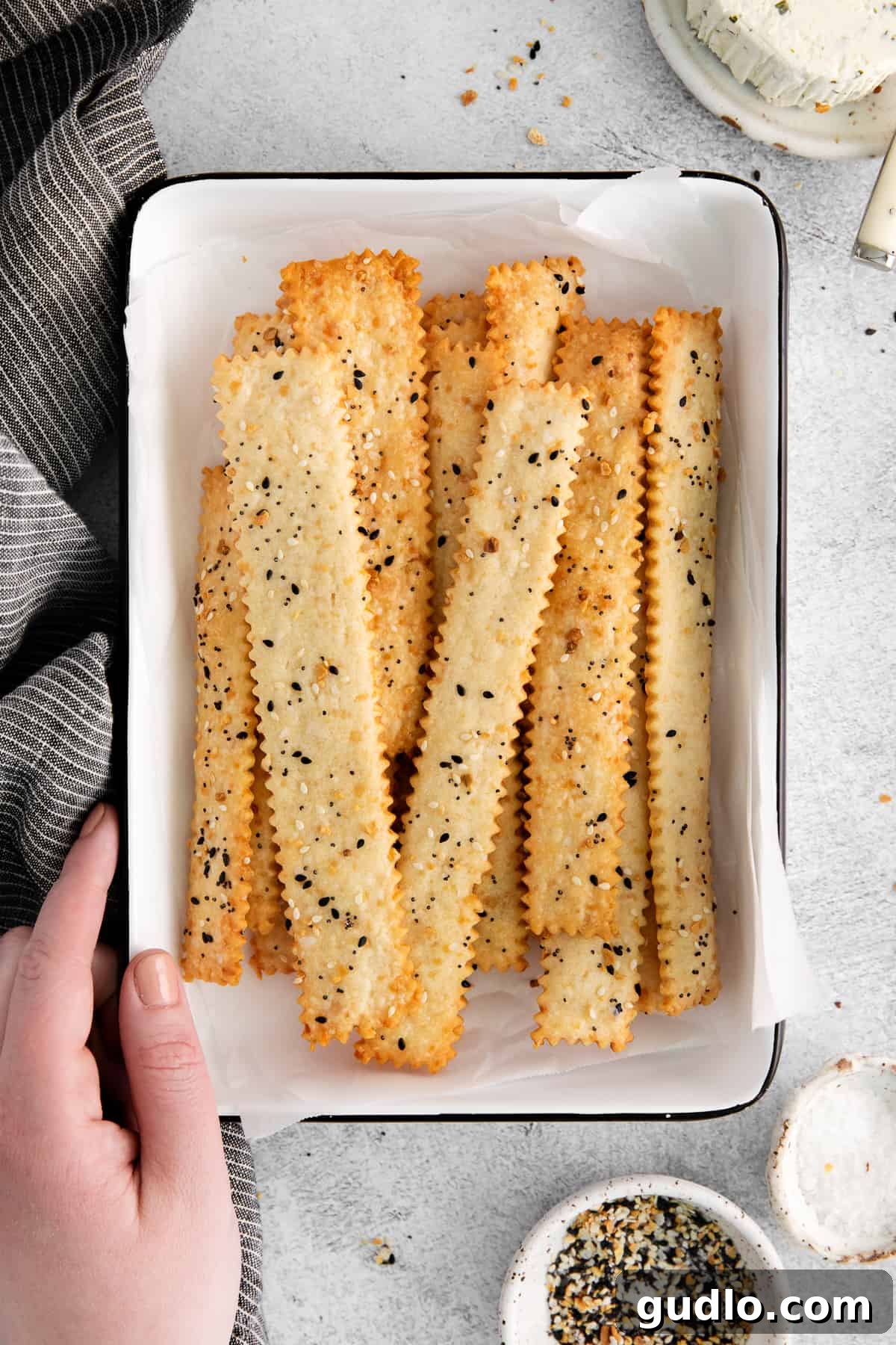 Homemade Crunchy Cheese Crackers Beautifully arranged homemade cheese crackers in a rustic dish, showcasing their golden-brown color and perfectly crunchy texture.