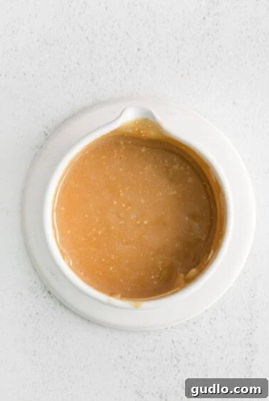 Homemade balsamic dressing whisked in a bowl.