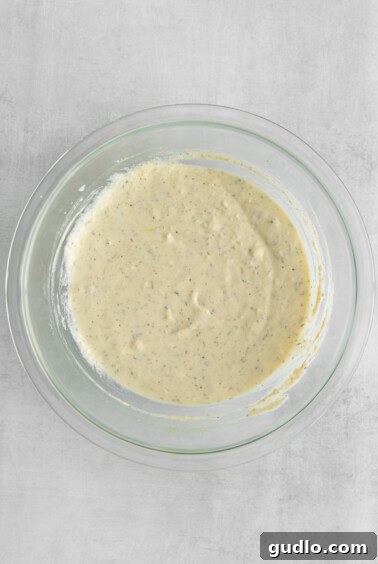 Ultimate Cheese Lasagna 2 A bowl of the creamy ricotta cheese mixture, perfectly blended and seasoned, ready to be layered into the lasagna.