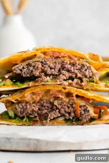 A perfectly assembled quesadilla burger, showcasing its cheesy tortillas and savory fillings.