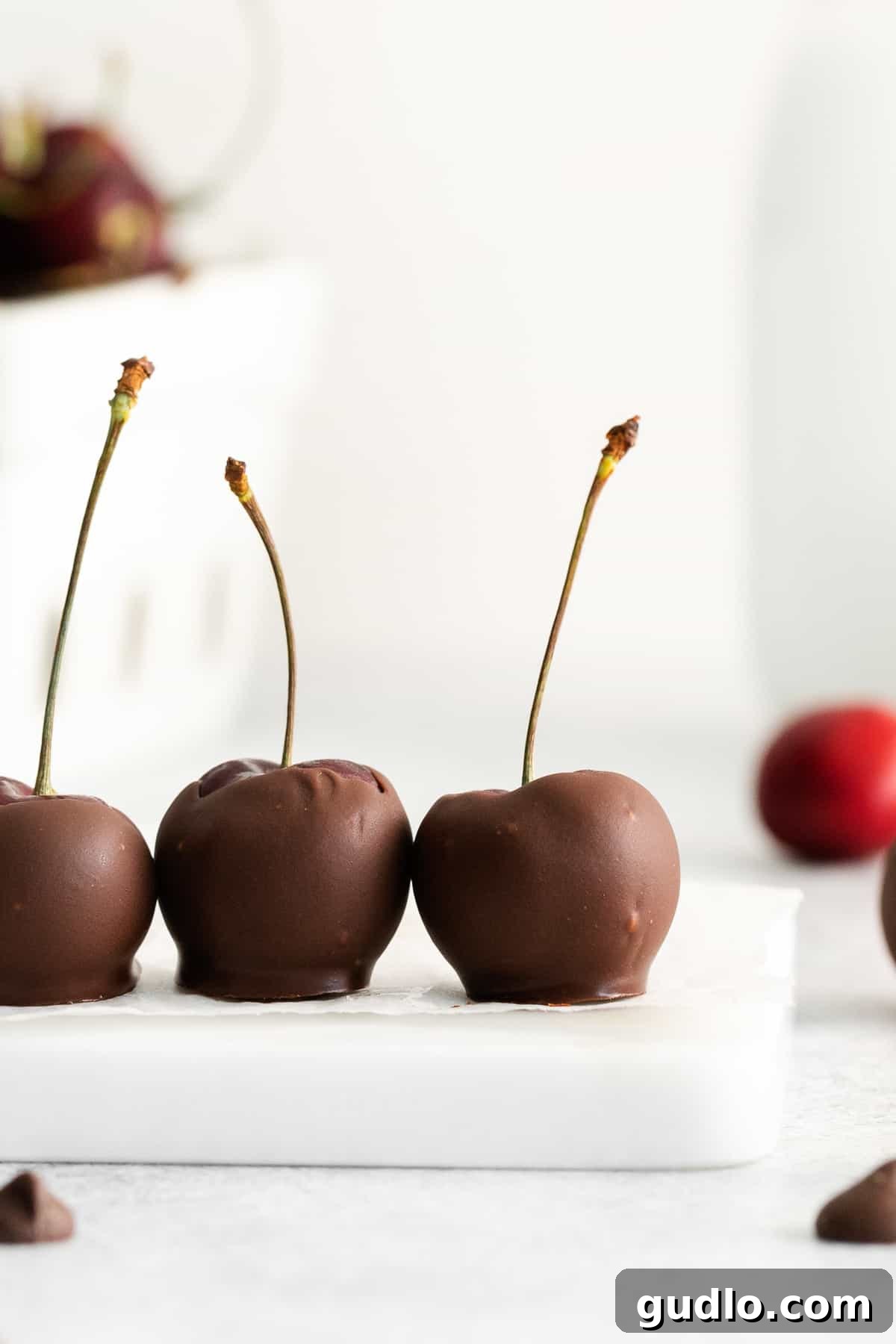Velvet Cherry Mascarpone Chocolates 2 A beautiful platter of homemade chocolate covered cherries, each with a creamy mascarpone center, ready for serving.