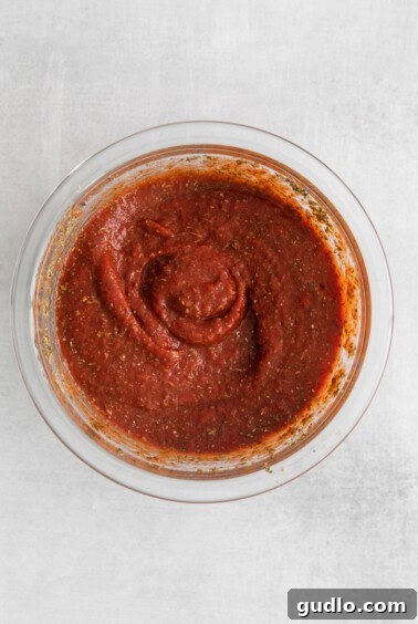Pizzagna Swirls 4 Homemade pizza sauce in a bowl.