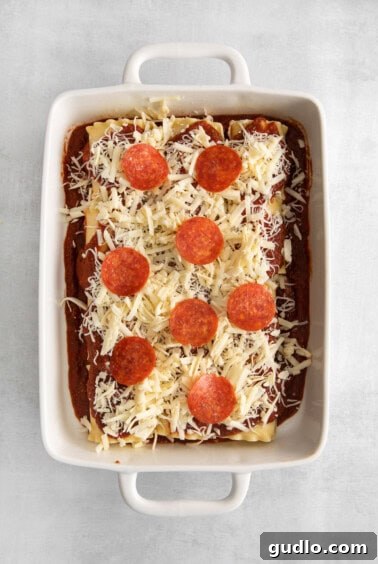 Pizzagna Swirls 9 Pepperoni and cheese covering the assembled lasagna roll ups.