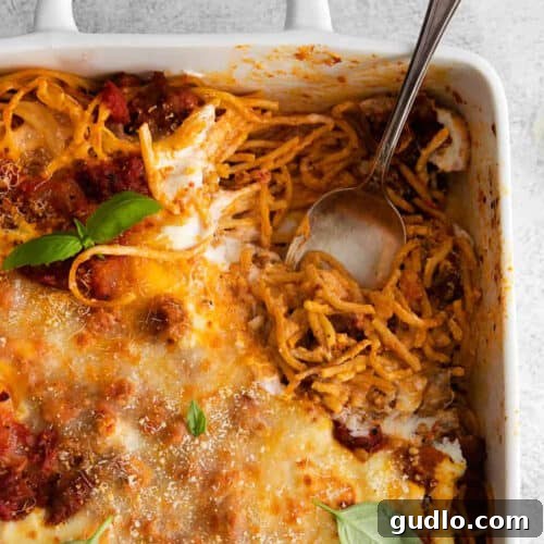 Ultimate Cream Cheese Spaghetti Bake 2 A casserole dish filled with baked spaghetti, golden and bubbling.