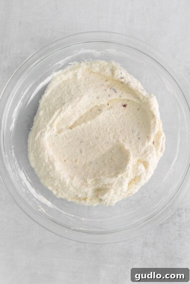 whipped cream cheese and ricotta mixture in a glass bowl.