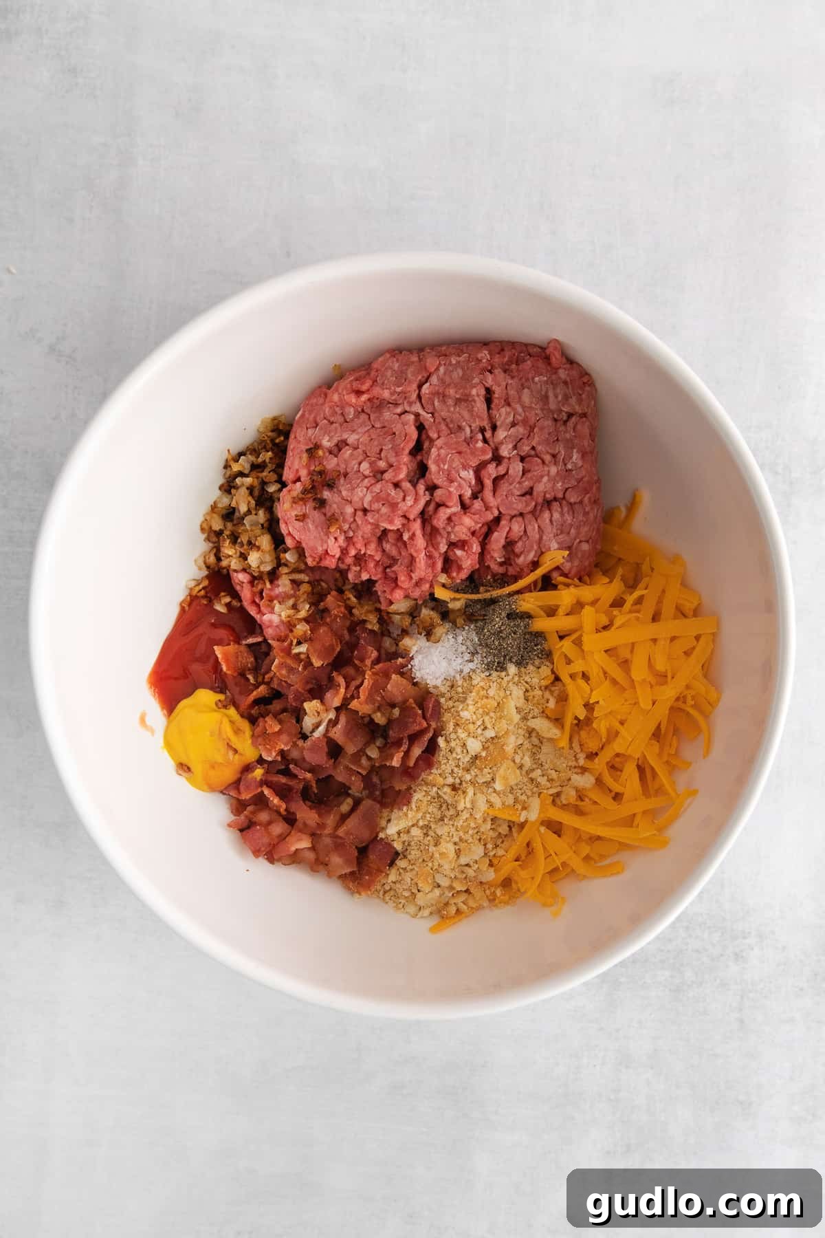 Assembling Your Cheeseburger Meatball Ingredients A selection of fresh ingredients including ground beef, bacon, cheese, and condiments, prepared for cheeseburger meatballs.