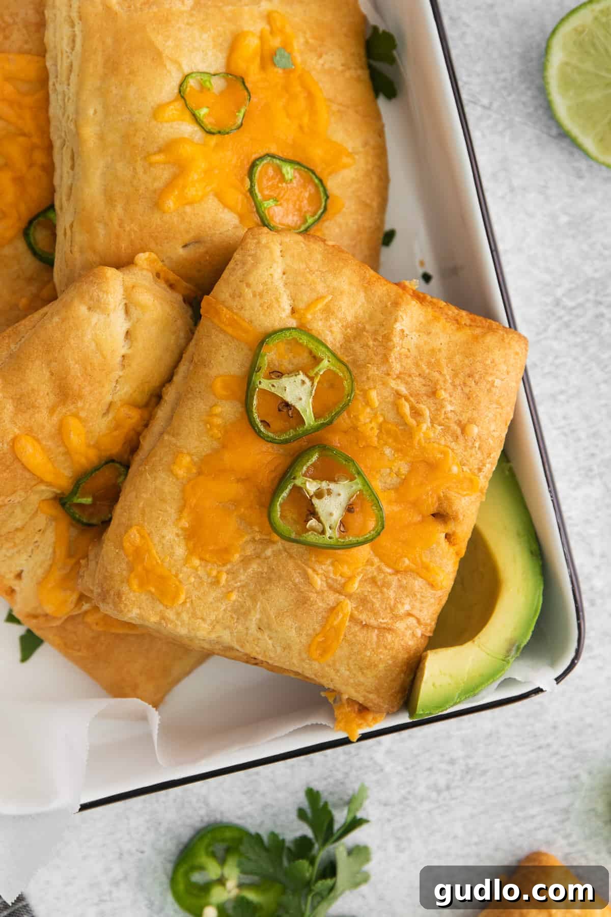 Effortless Taco Pockets 7 A serving tray laden with perfectly baked taco pockets, ready to be enjoyed as a meal or appetizer.