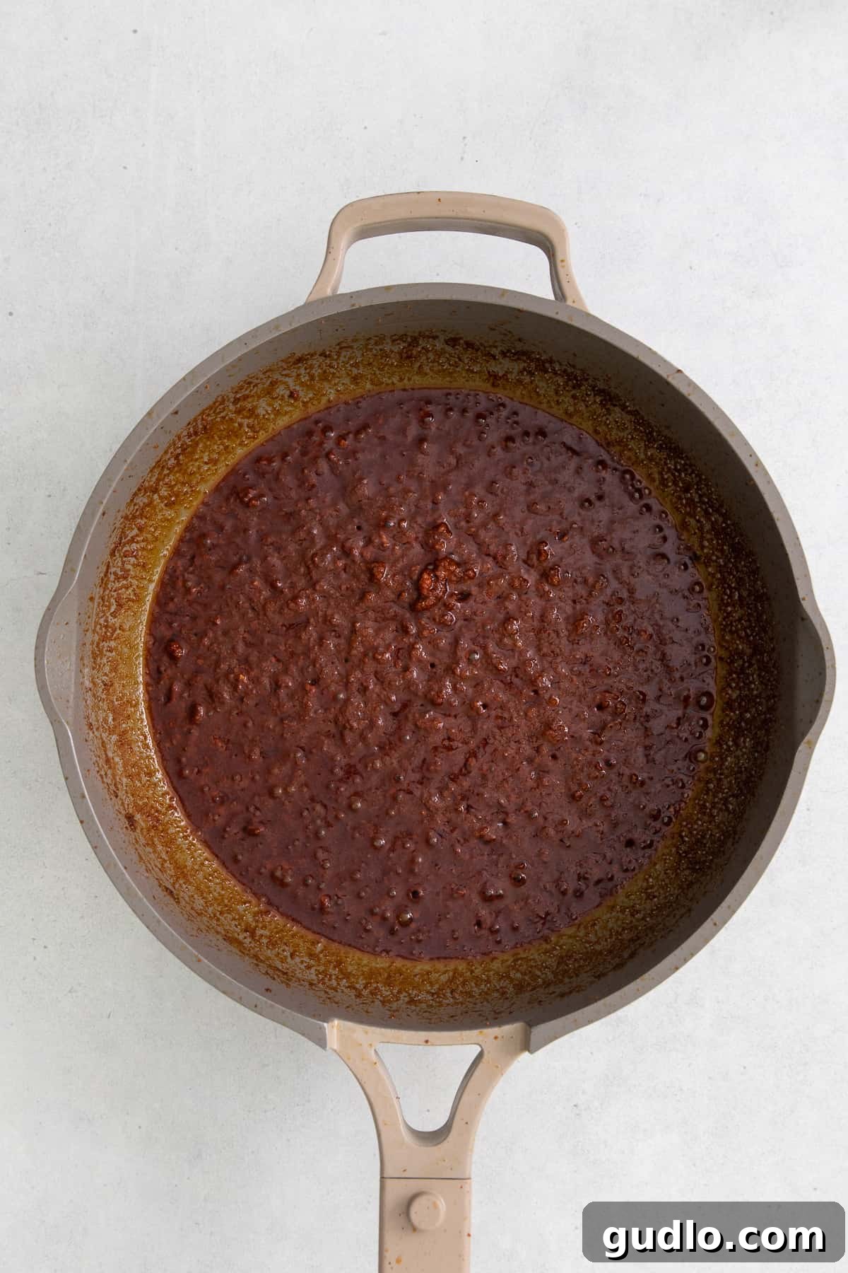 Velveeta Dream Dip 5 Crumbled and cooked chorizo sizzling in a non-stick pan, ready for the next steps.