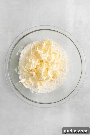 Grated butter in flour mixture.