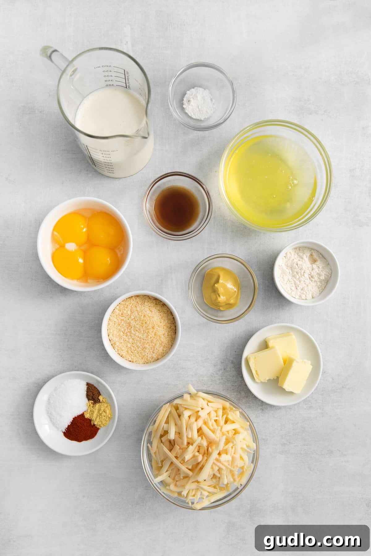 Assortment of fresh ingredients laid out for making cheese soufflé.
