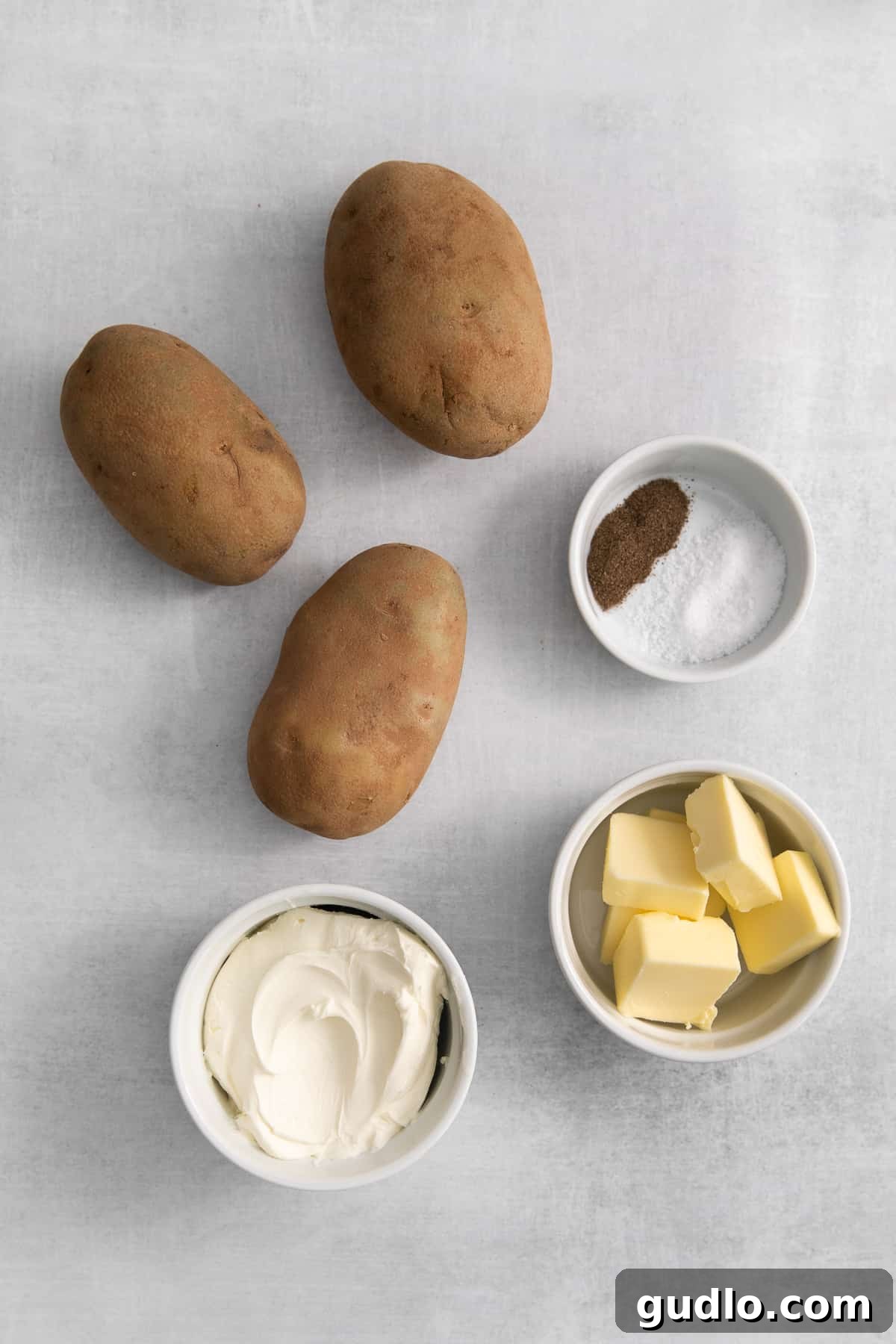 Velvet Smooth Cream Cheese Potatoes 2 Ingredients for cream cheese mashed potatoes displayed on a counter.