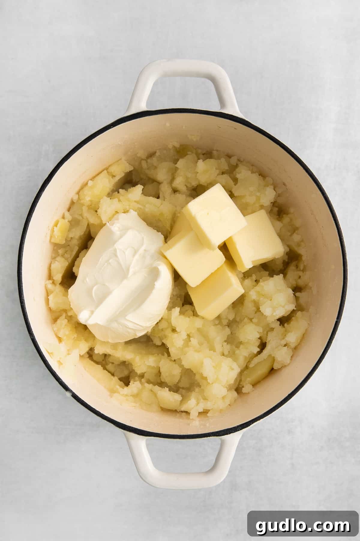 Velvet Smooth Cream Cheese Potatoes 4 Softened cream cheese and butter ready to be added to mashed potatoes.