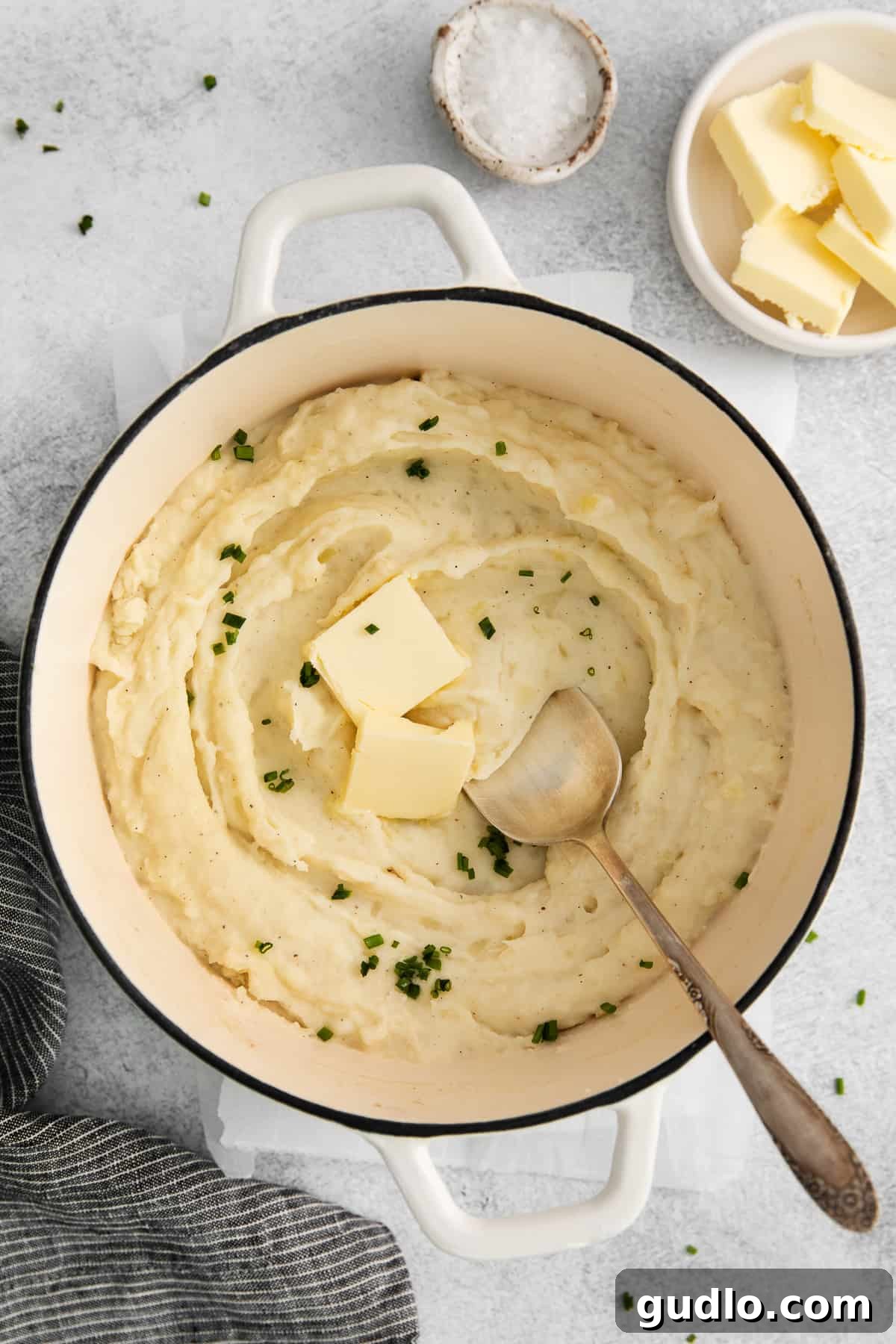 Velvet Smooth Cream Cheese Potatoes 5 Freshly made cream cheese mashed potatoes ready to serve, garnished with herbs.