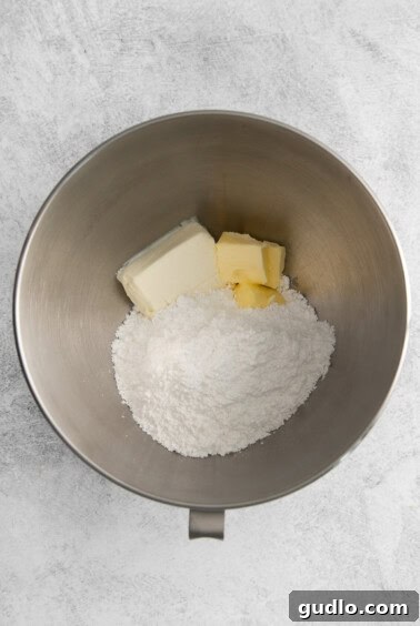 Ingredients being mixed in a bowl with a hand mixer.