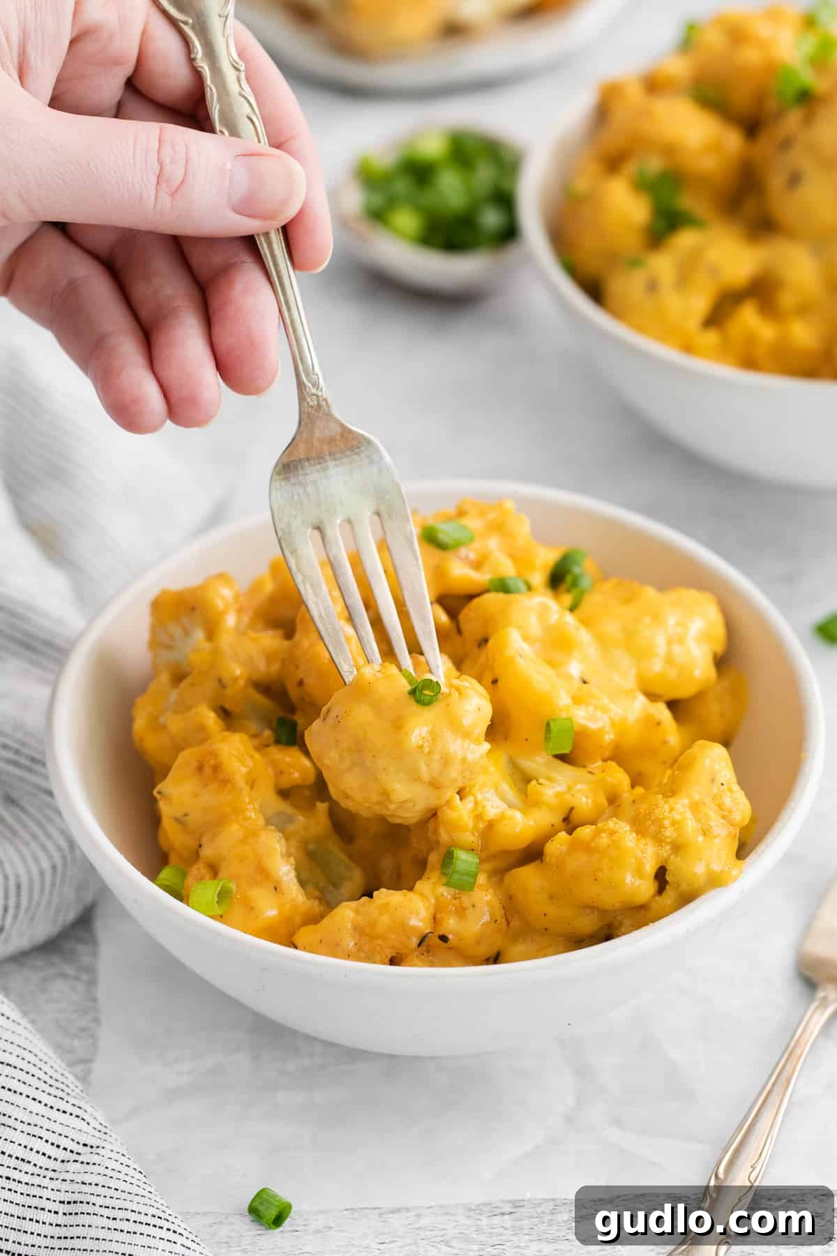 A beautifully presented bowl of creamy cauliflower mac and cheese, ready to be enjoyed.