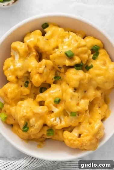 A bowl of cauliflower mac and cheese, ready to eat.