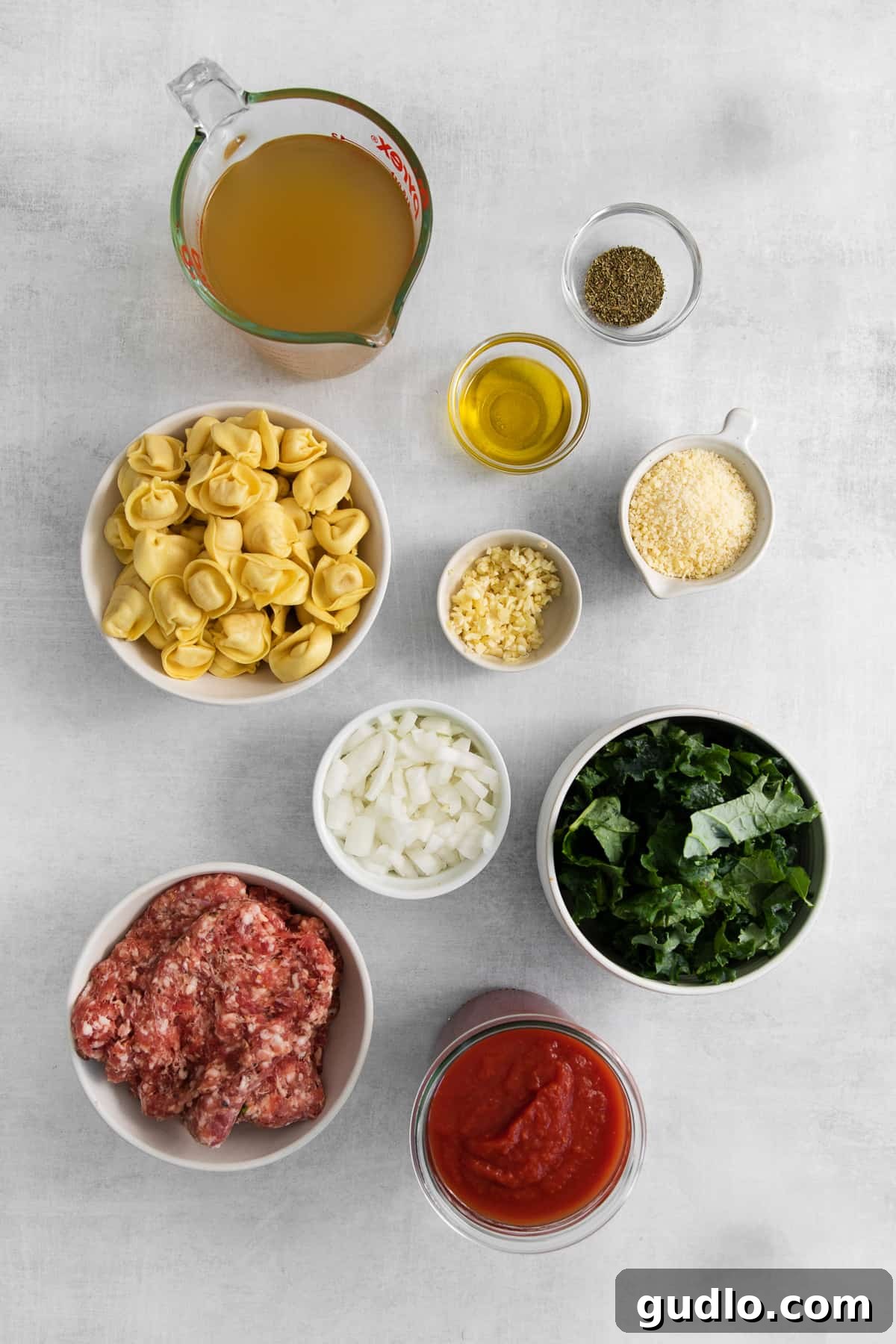Fresh Ingredients for a Flavorful Cheese Tortellini Soup Individual ingredients for cheese tortellini soup displayed in small bowls.