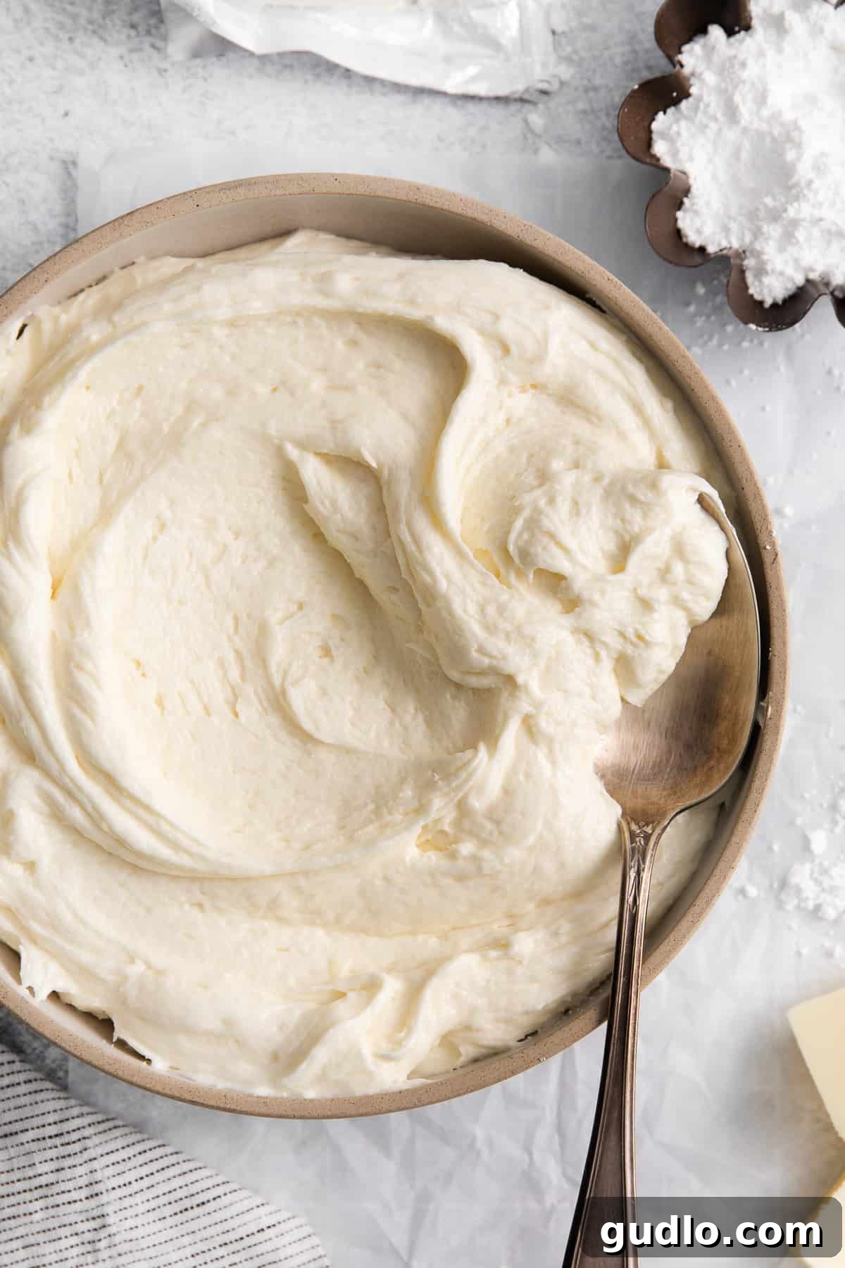 This cream cheese buttercream frosting is ultra-rich, creamy, and ridiculously easy to make! Cream cheese buttercream frosting in a bowl.
