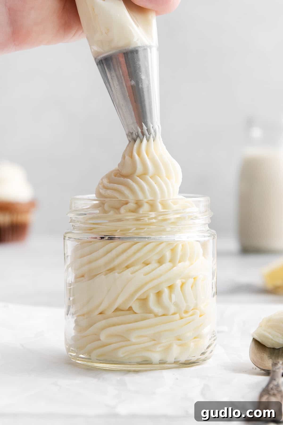 This cream cheese buttercream frosting is ultra-rich, creamy, and ridiculously easy to make! Cream cheese buttercream frosting in a jar.