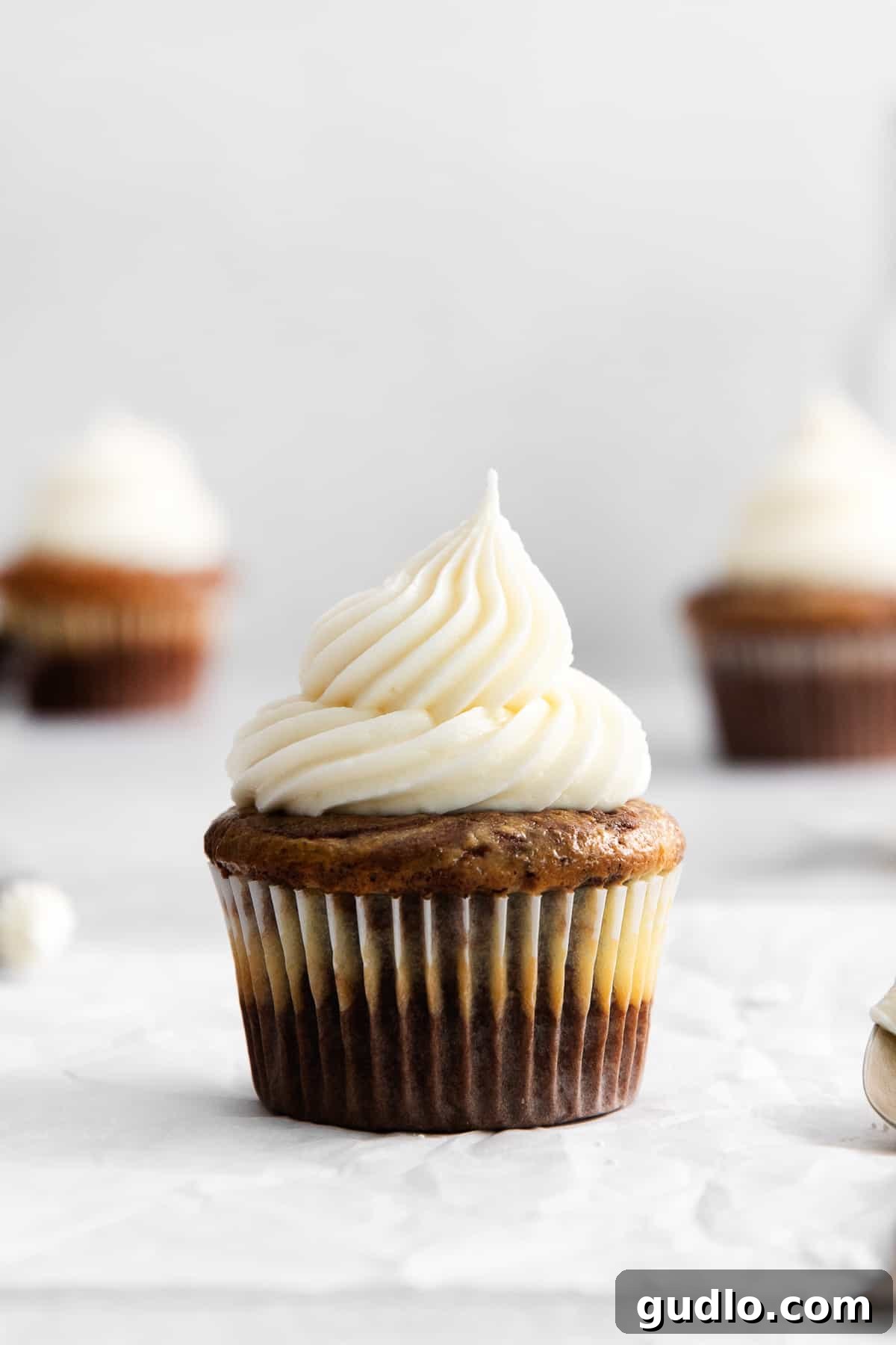 This cream cheese buttercream frosting is ultra-rich, creamy, and ridiculously easy to make! Cream cheese buttercream frosting on a cupcake.