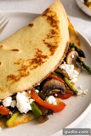 A beautifully arranged plate of goat cheese crepes, filled and ready to serve.