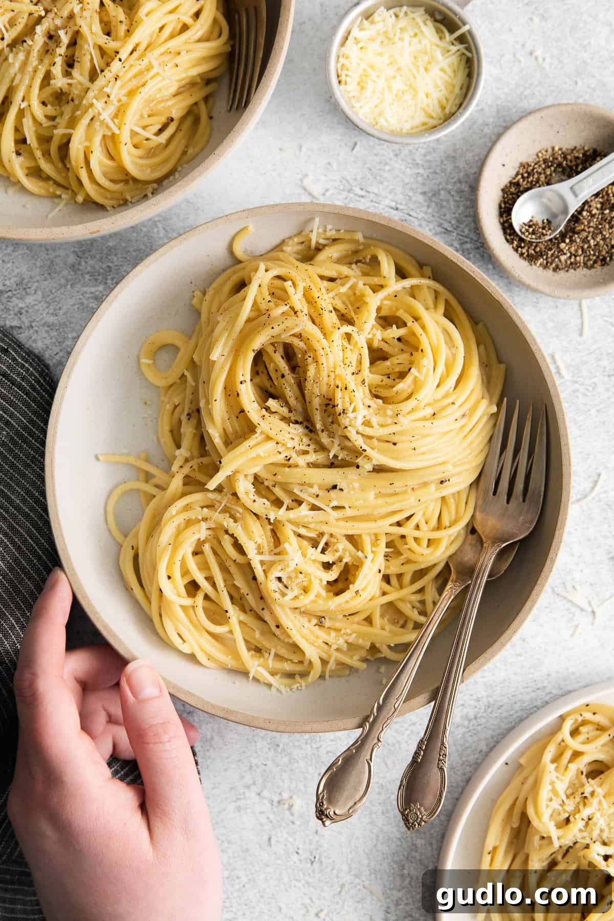 Cacio e pepe on a plate with a fork.