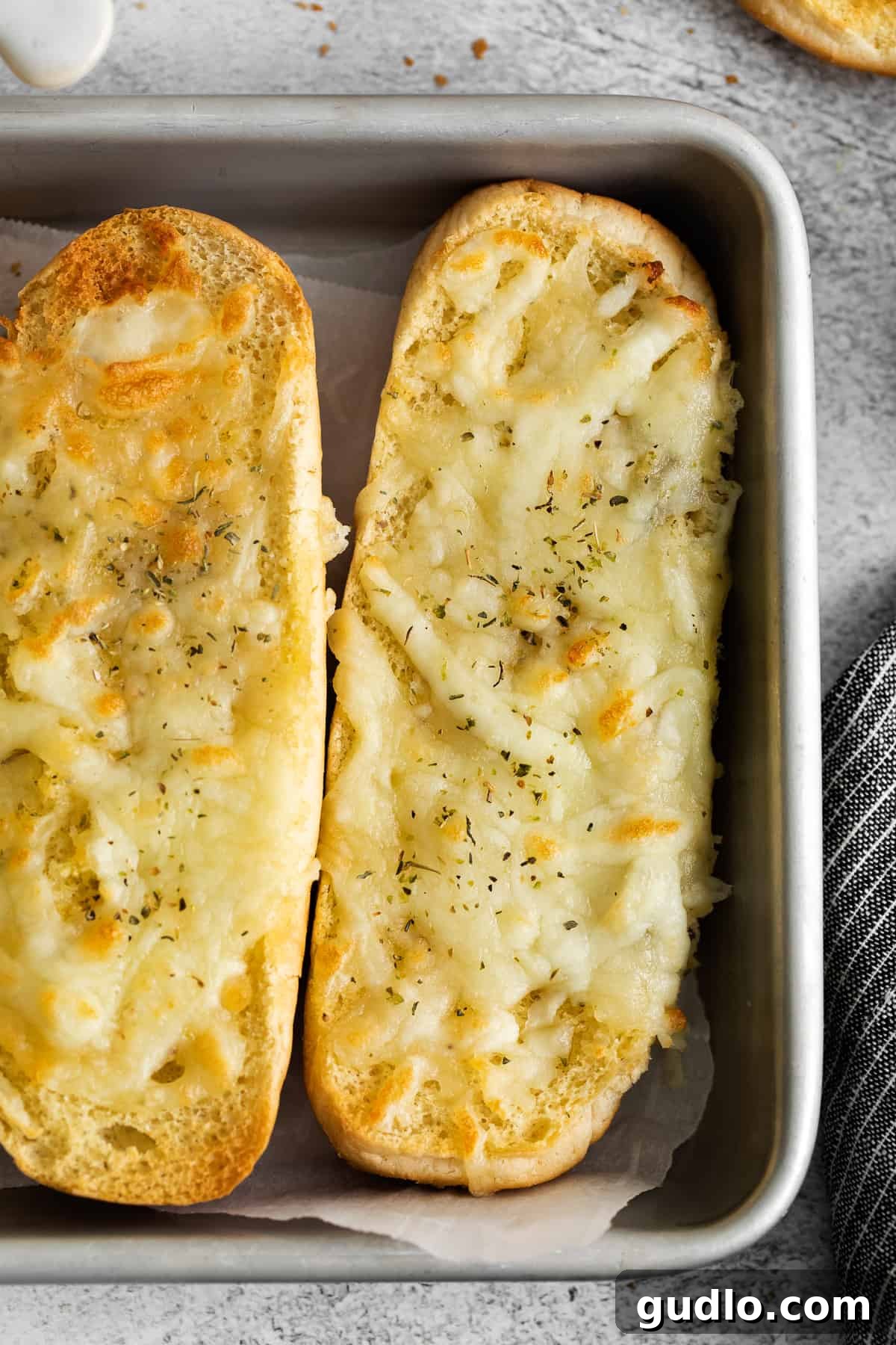 Warm Italian Dunkers Ready to Serve Freshly baked Italian dunkers arranged on a baking sheet, showcasing their appealing golden crust and melted cheese.