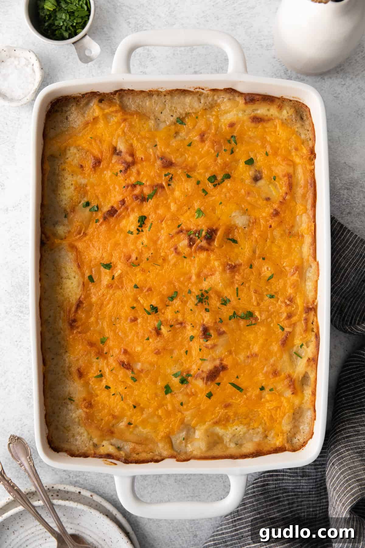 Golden-Topped Cheesy Shepherd's Pie 6 A bubbling cheesy shepherd's pie fresh from the oven, showing a golden brown crust and rich filling.