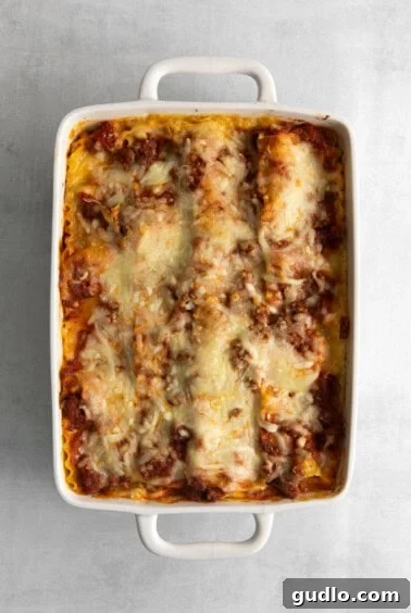 Homestyle Cottage Lasagna 14 A freshly baked cottage cheese lasagna, golden and bubbling, resting on a trivet.
